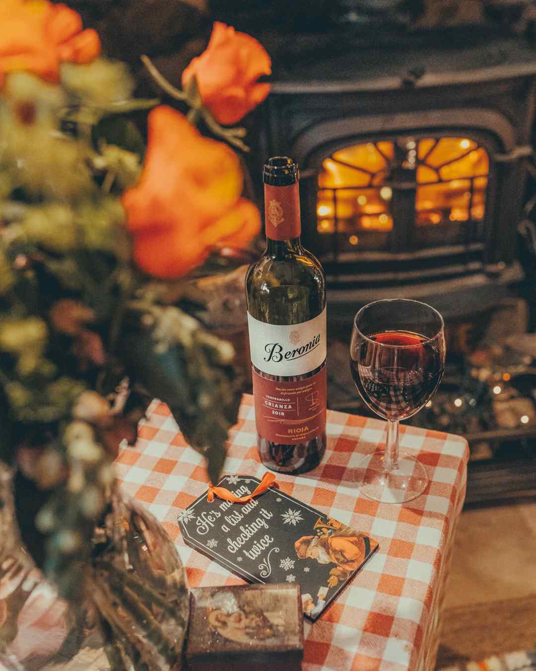 Bottle of Beronia Wine in front of a wood burning stove produced by YesMore Wine Advertising Agency