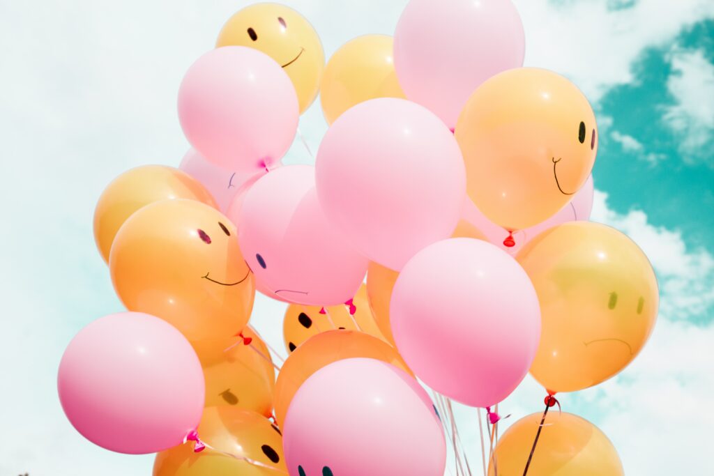 Balloons with smiley faces on them